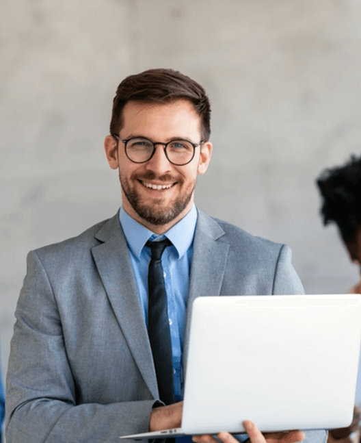 Man working on laptop in airplane