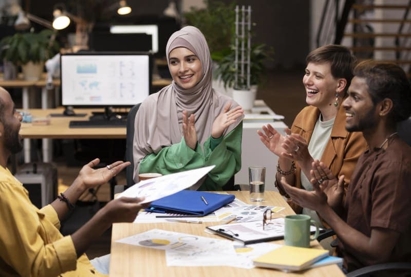 Man working on laptop in airplane